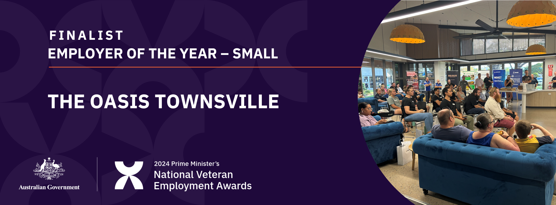 White text on dark purple background: Finalist Employer of the year - small - The Oasis Townsville - with a photo of a group of people seated on chairs and couches watching a presentation