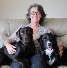 Picture of Angie Weeks and two dogs on a couch